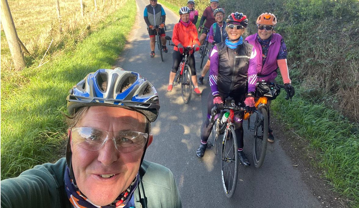 An image of a selfie of 8 of people on their bikes from one of our Halcyon Cycling Holiday trips.
