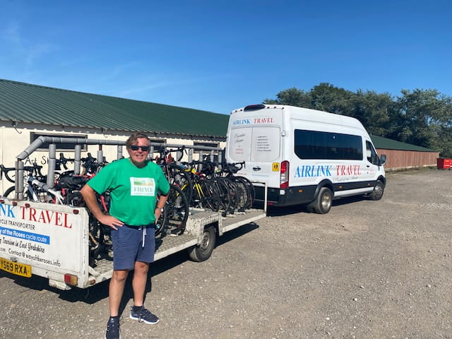 An image of Andrew transporting bikes.