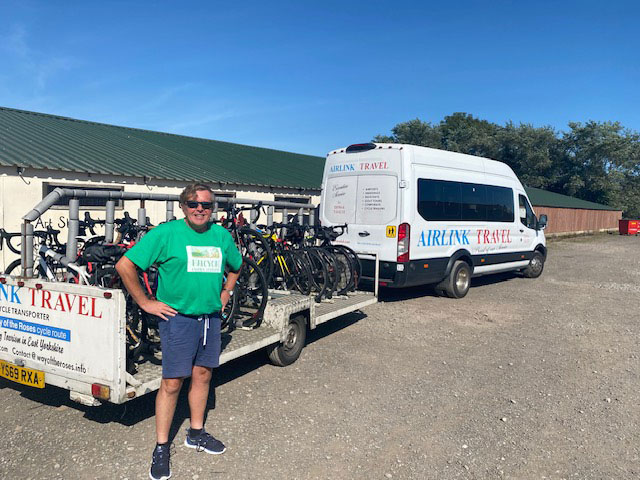 An image of Andrew transporting bikes.