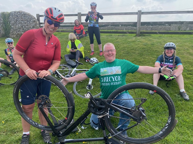 An image of a group fixing a bike.